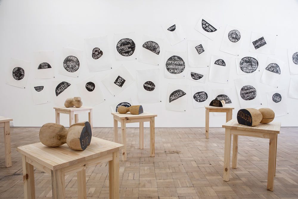 Barthélémy Toguo, The New World Climax, 2000–2014. Installation with wooden stamps, tables, ink prints on paper. Courtesy Stevenson, Cape Town and Johannesburg; Bandjoun Station Cameroun. Photo Mario Todeschini